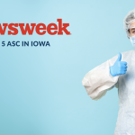 Newsweek Top ASC In Iowa words next to a doctor with their thumbs up.